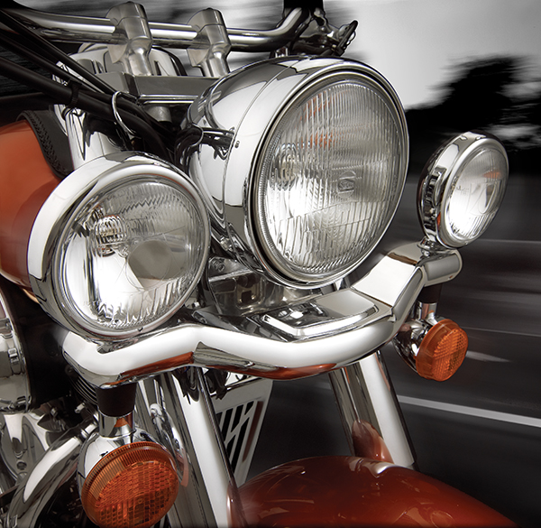 Large image view of a Honda Shadow motorcycle chrome headlamp lightbar and lamps