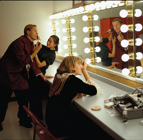 Actors in front of makeup mirror